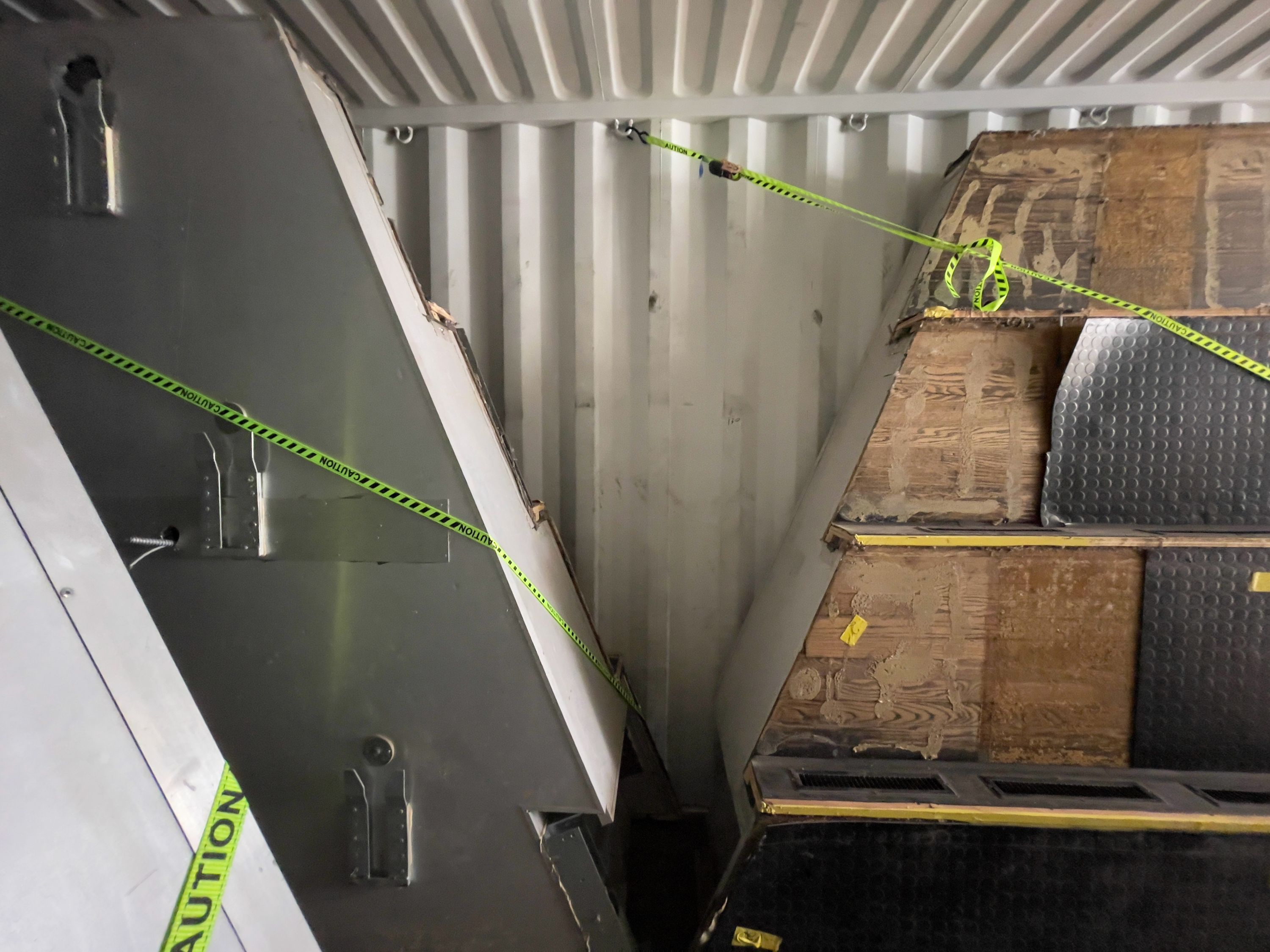 Marissa Lee Benedict, Daniel de Paula, and David Rueter, Components of the Corn Pit loaded into a shipping container in Chicago, en route to São Paulo