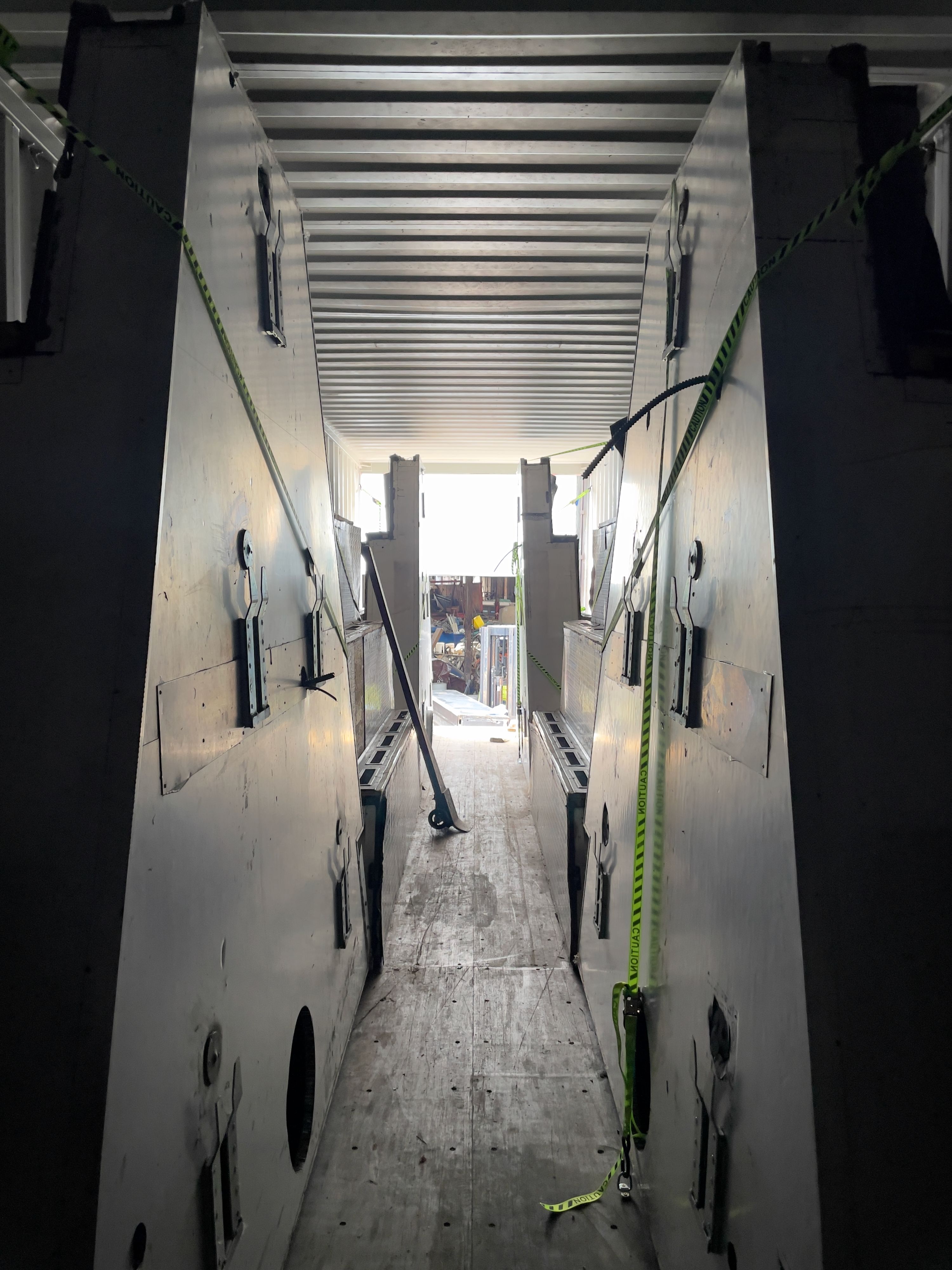 Marissa Lee Benedict, Daniel de Paula, and David Rueter, Components of the Corn Pit loaded into a shipping container in Chicago, en route to São Paulo