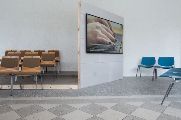 undefined, Metrica No. 5, 2026, 2026, Three-channel video installation with 5-channel audio, 20m TRT, Shot and performed on location in 2025, the artwork follows three psychotherapists as they enter the storage rooms of the Martynas Mažvydas National Library of Lithuania. Surrounded by shelves of documents, the women at the center of the performance score listen, question, and respond as the archive attempts to describe its fears and desires. Critical questions of selfhood, consciousness, and collective experience form and unravel as the sessions reflect upon the procedures of psychotherapy as they might apply to a subject whose “mind” is composed of an unfathomable mass of undead human writing. 

This new work is also part of Metrica, an evolving series of performances that stage encounters between public archives, psychoanalysts, and artificial intelligence, initiated by the artist duo in 2023 during their first stay in Vilnius at the Rupert residency programme. Their initial interest in land ownership histories in the region led Benedict and Rueter to two distinct repositories within Lithuanian history: the books of the Lithuanian Metrika—foundational administrative records of the 13th–17th century Duchy of Lithuania, held in 200 codices that have all been removed from Lithuania (the existing volumes are now in Moscow)—which have been digitized in a limited way by historians at Vilnius University; and oral histories of the 1990s post-Soviet Lithuanian administrative processes, developed by the newly independent state to re-privatize and repatriate land, which eventually resulted in a new digital government land register. Out of encounters between these archives, the artists, and artificial intelligence systems, the Metrica series produces a variety of conversational forms that engage what might be understood as the institutional unconscious.

For the most recent performances (Metrica No. 5-7, 2025 – ongoing), Benedict and Rueter invite professional psychotherapists to conduct intake sessions with the “psyches” of public archives. Voiced through an AI agent engineered by the artists, the archival psyches draw from historical land records, administrative documents, and literary texts – official records recast as personal memories. 
